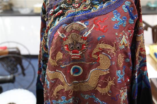 A Chinese claret satin embroidered silk and metal thread dragon robe, late Qing dynasty,